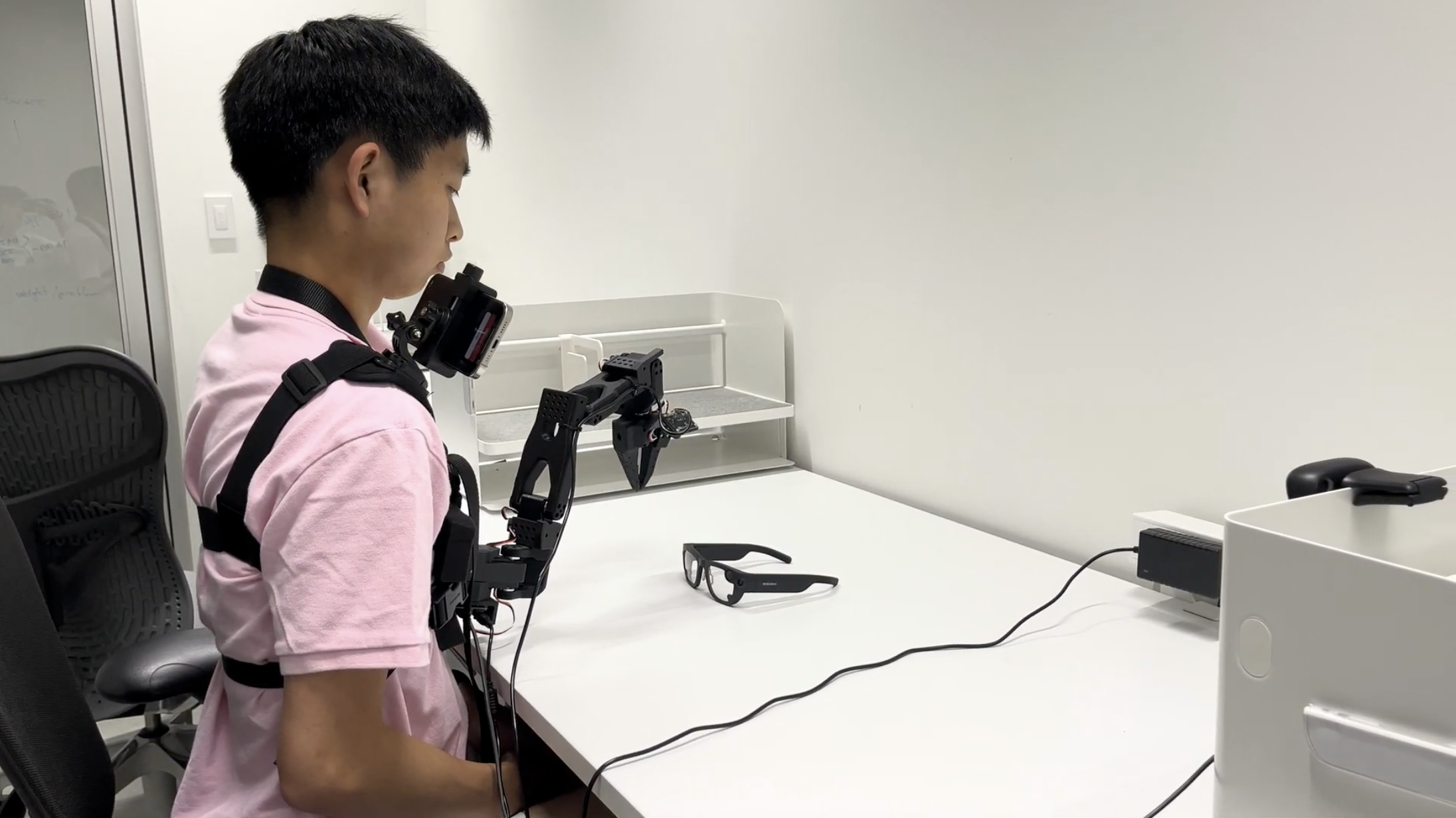 Human-mounted supernumerary arm concept